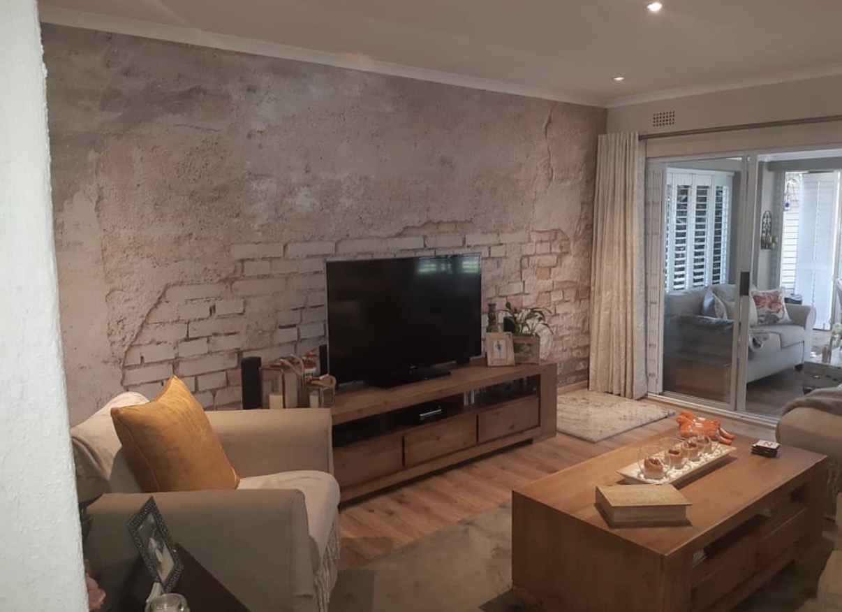 Custom wallpaper mural feature wall - Rustic Brick Living Room installation